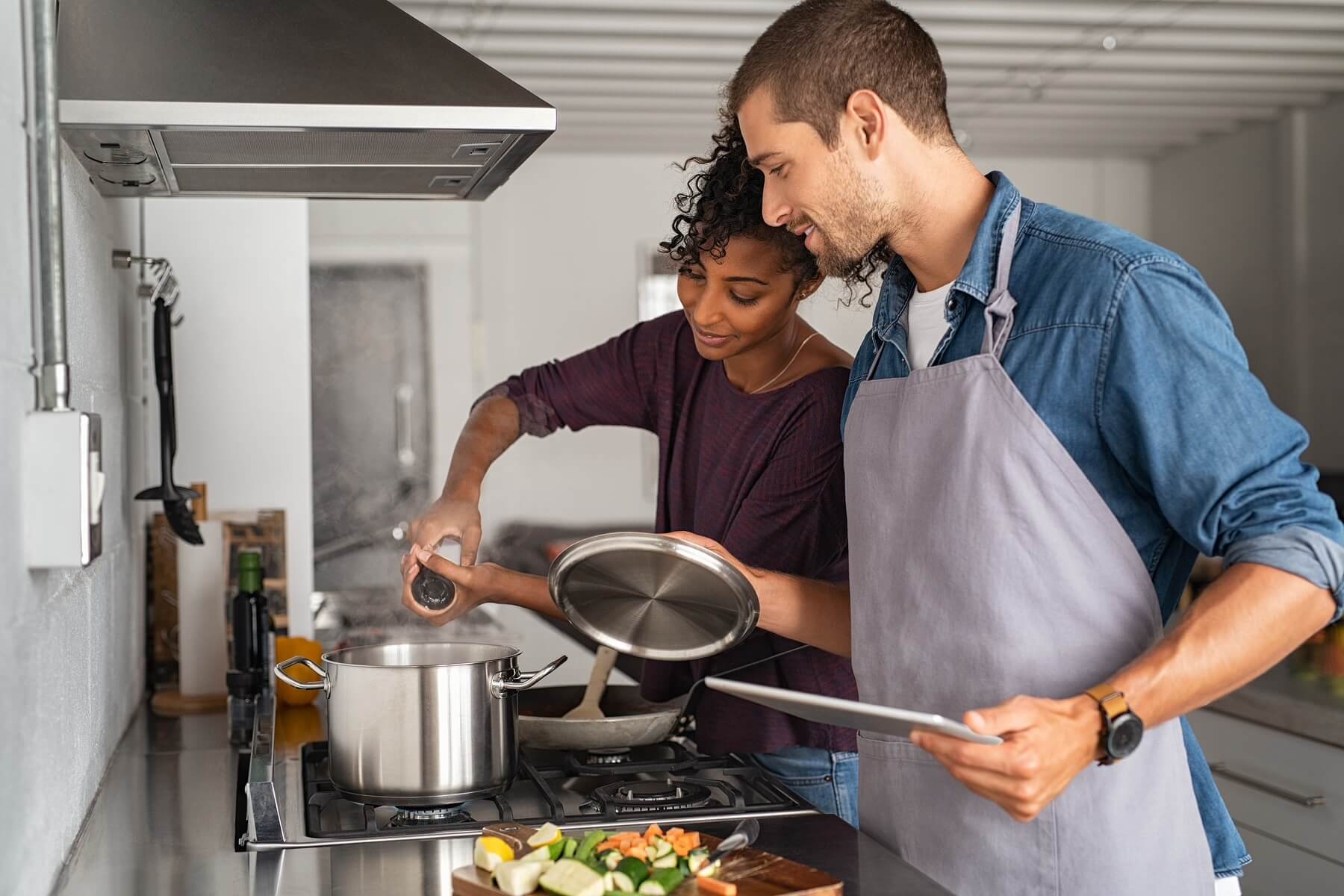 Couple cooking dinner together