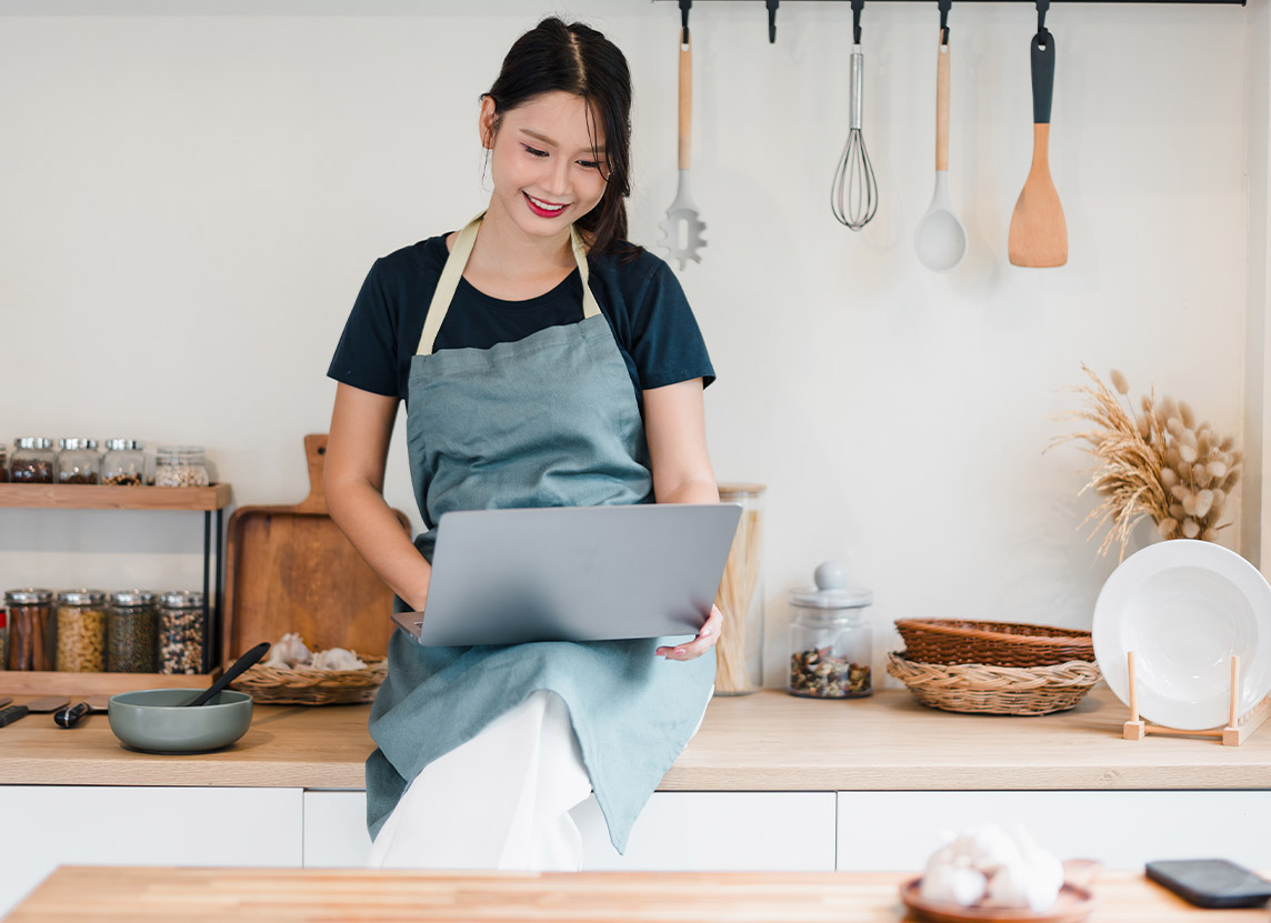 Community-Tile_Woman_Kitchen_Laptop